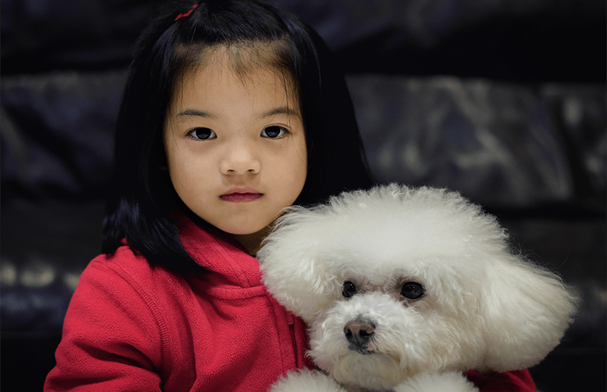 Girl and poodle