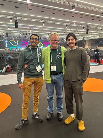 iGEM co-captains pose together with their advisor Baskin Engineering Associate Teaching Professor David Bernick standing in the middle